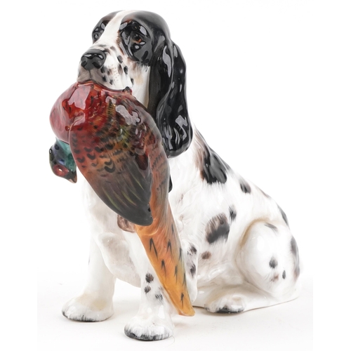 657 - Royal Doulton seated Cocker Spaniel with Pheasant, HN1137, 17cm in length