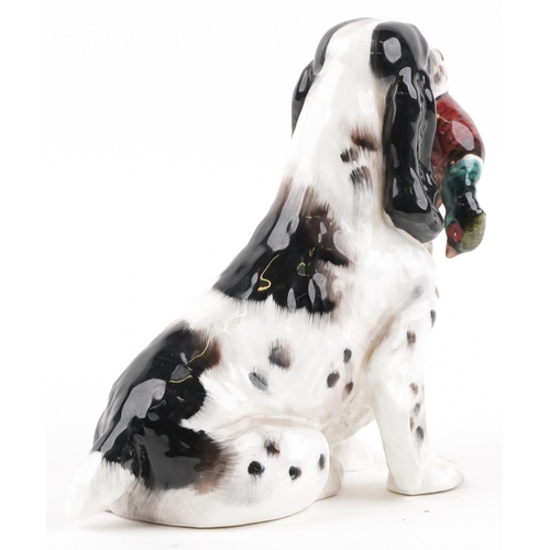 657 - Royal Doulton seated Cocker Spaniel with Pheasant, HN1137, 17cm in length