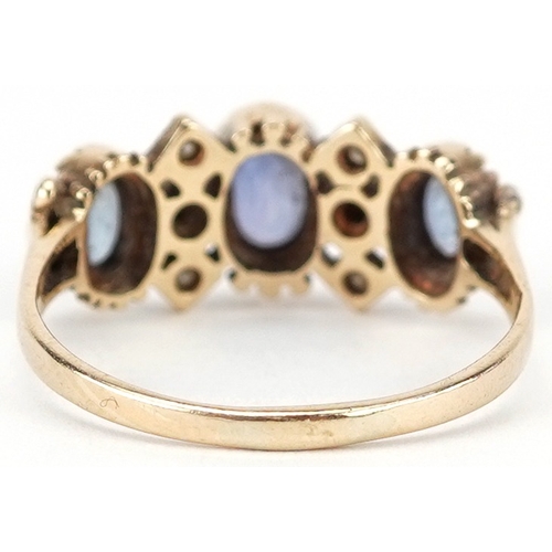2214 - 9ct gold sapphire and diamond cluster ring, the largest sapphire approximately 6.60mm x 4.70mm x 2.9... 