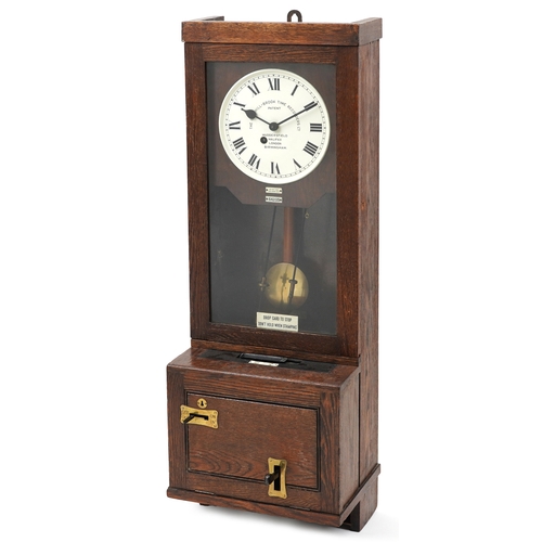 597 - Gledhill-Brook Time Recorders patent oak clocking in machine having circular dial with Roman numeral... 