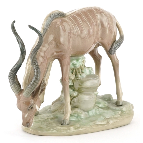 635 - Lladro antelope on naturalistic base, 5302, 23cm in length