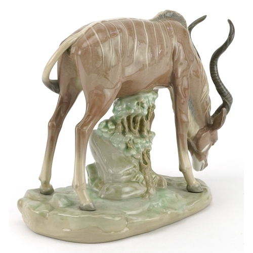 635 - Lladro antelope on naturalistic base, 5302, 23cm in length