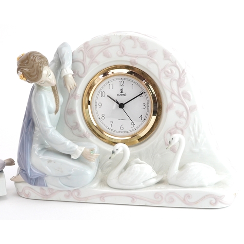 634 - Two Lladro mantle clocks comprising Swan clock 5230 and Two Sisters clock 5770, the largest 32cm wid... 