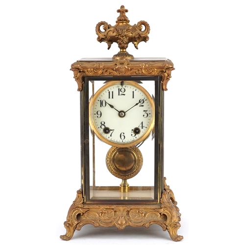 363 - 19th century ormolu four glass mantle clock striking on a gong with urn finial and circular enamelle... 