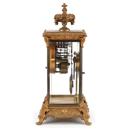 363 - 19th century ormolu four glass mantle clock striking on a gong with urn finial and circular enamelle... 