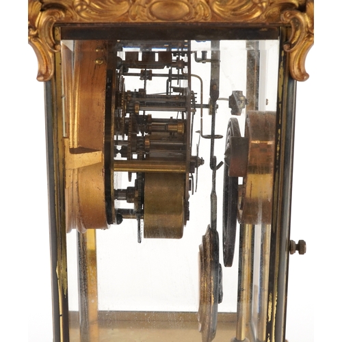 363 - 19th century ormolu four glass mantle clock striking on a gong with urn finial and circular enamelle... 