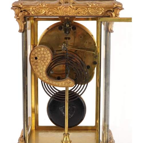 363 - 19th century ormolu four glass mantle clock striking on a gong with urn finial and circular enamelle... 