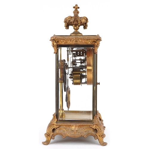 363 - 19th century ormolu four glass mantle clock striking on a gong with urn finial and circular enamelle... 