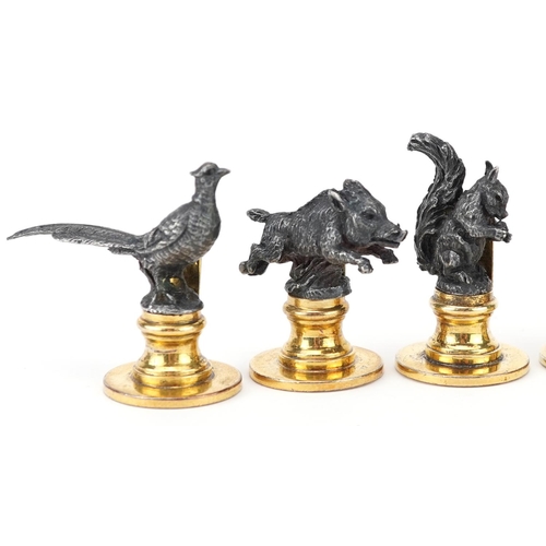 302 - Gucci, set of six Italian silver and silver gilt menu/name place card holders in the form of game in... 