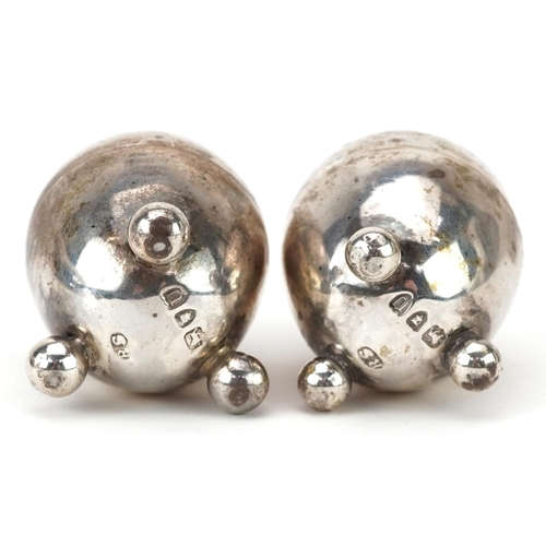 399 - Robert Stebbings, pair of Victorian silver egg shape casters with ball feet, London 1895, each 3.8cm... 