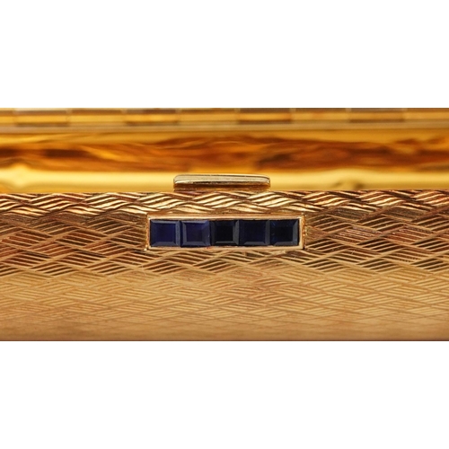 29 - Boucheron, 18ct gold engine turned  minaudière with sapphire set clasp, housed in a Boucheron London... 