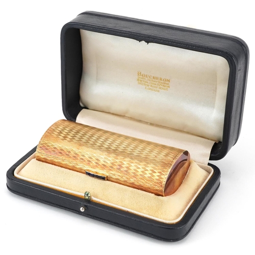 29 - Boucheron, 18ct gold engine turned  minaudière with sapphire set clasp, housed in a Boucheron London... 