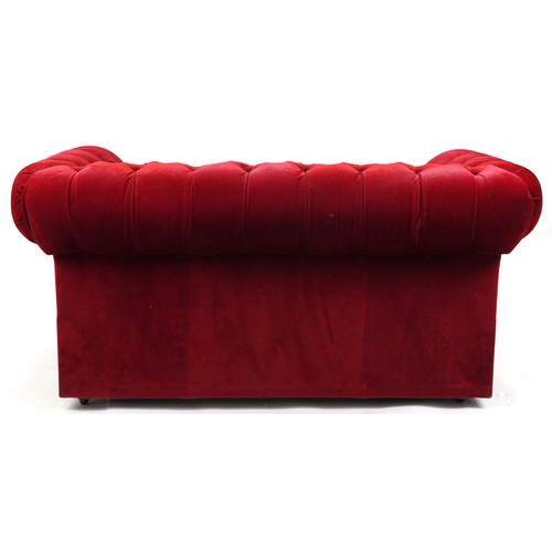 1179 - Chesterfield two seater settee/sofa bed with red button back upholstery, 73cm H x 152cm W x 88cm D