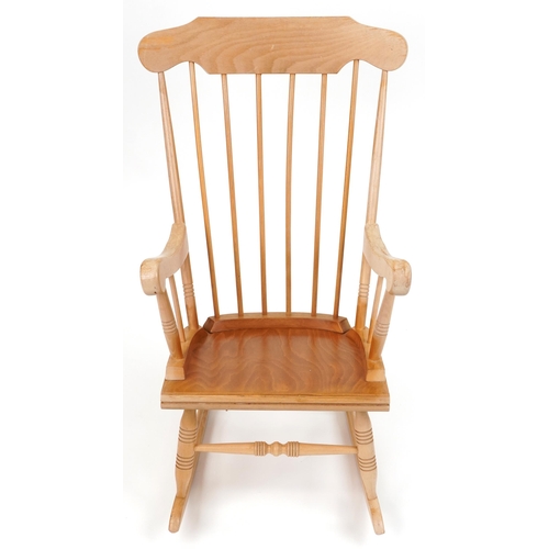 1144 - Lightwood rocking chair with check upholstered cushions, 102cm high