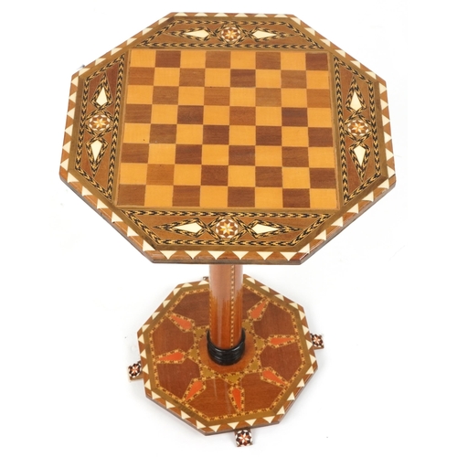 1178 - Manner of Liberty & Co, Moorish style inlaid chess occasional table with octagonal top and base, 50c... 