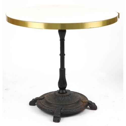 1129A - Contemporary circular bistro table with cast iron base and two mahogany chairs with cushions, the ta... 