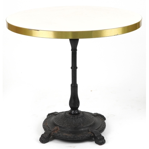 1187 - Contemporary circular bistro table with cast iron base and two mahogany chairs with cushions, the ta... 