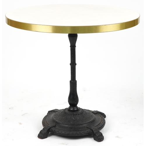 1187 - Contemporary circular bistro table with cast iron base and two mahogany chairs with cushions, the ta... 