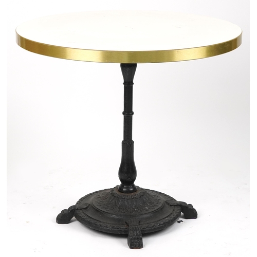 1165 - Contemporary circular bistro table with cast iron base and two mahogany chairs with cushions, the ta... 