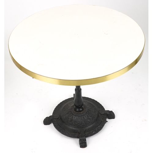 1165 - Contemporary circular bistro table with cast iron base and two mahogany chairs with cushions, the ta... 