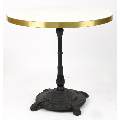 1165 - Contemporary circular bistro table with cast iron base and two mahogany chairs with cushions, the ta... 