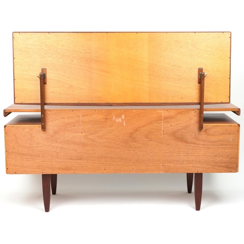 1006 - G Plan, Mid century Fresco teak dressing chest with mirrored back fitted with an arrangement of four... 