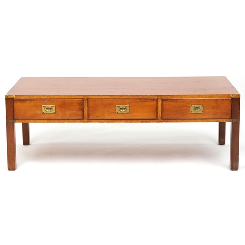 1103 - Military interest yew wood campaign style coffee table with three frieze drawers and brass mounts, 4... 