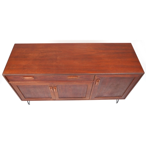 1003 - G Plan, Mid century Fresco teak sideboard on hairpin legs fitted with a door and an arrangement of t... 