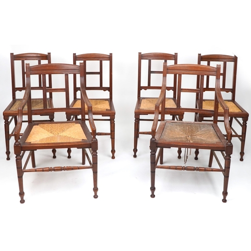 Blyth & Sons of Chiswell Street London, set of six Victorian aesthetic walnut dining chairs including two carvers, each with rush seat, plaque to the underside of each, each 93cm high