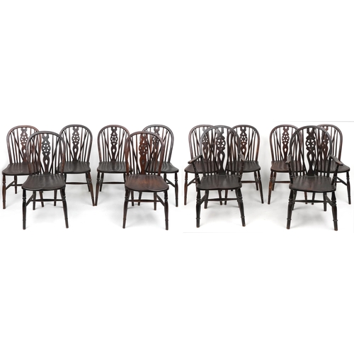 1099 - Set of eight antique oak wheel back dining chairs together with two oak wheel back carver chairs, so... 