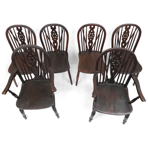 1099 - Set of eight antique oak wheel back dining chairs together with two oak wheel back carver chairs, so... 