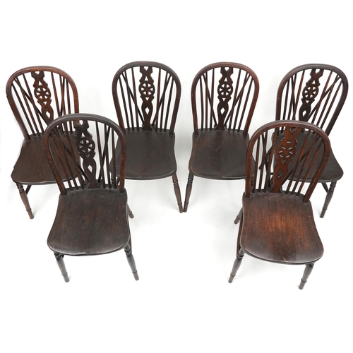 1099 - Set of eight antique oak wheel back dining chairs together with two oak wheel back carver chairs, so... 