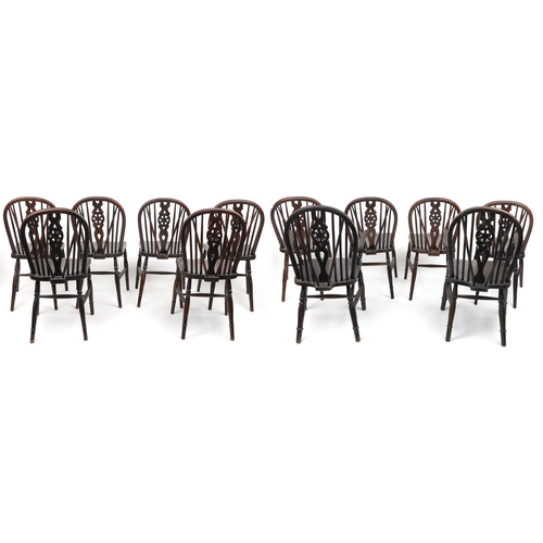 1099 - Set of eight antique oak wheel back dining chairs together with two oak wheel back carver chairs, so... 