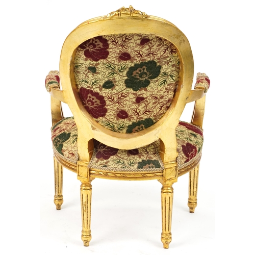 1162 - French Baroque style giltwood elbow chair having cream, red and green floral upholstery, 96.5cm high