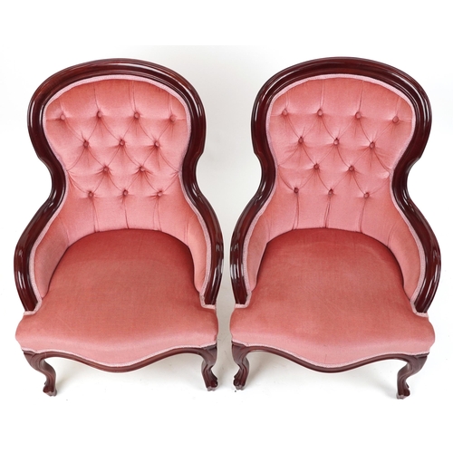 1167 - Pair of Victorian style mahogany bedroom chairs with salmon button back upholstery, each 82cm high