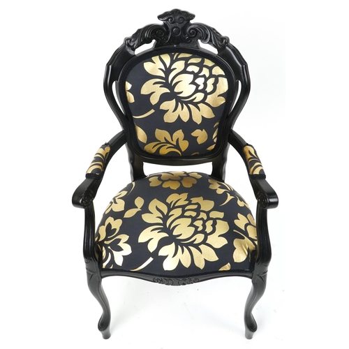 1218 - French style black painted elbow chair with black and gold floral upholstery, 103cm high