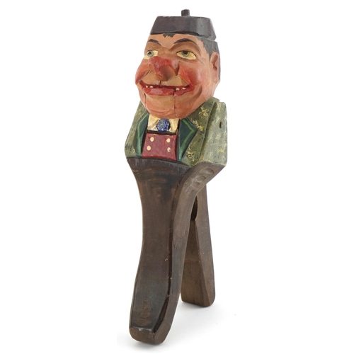 1263 - Pair of painted Black Forest carved wood nut crackers in the form of a man, 21.5cm high