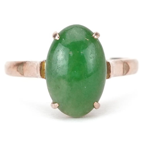 2252 - Chinese 14K gold cabochon green jade ring housed in a J Perry Nottingham jeweller's box, the jade ap... 