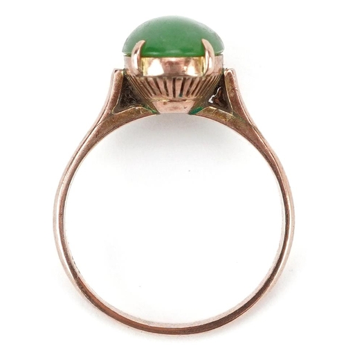 2252 - Chinese 14K gold cabochon green jade ring housed in a J Perry Nottingham jeweller's box, the jade ap... 