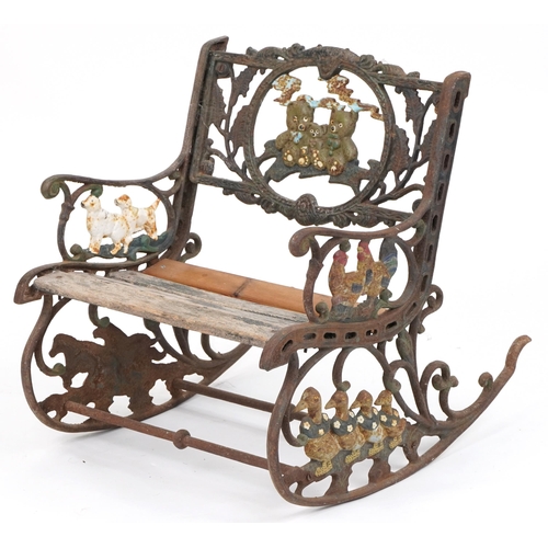 1118 - Child's painted cast iron rocking chair with wooden slats, cast with teddy bears and animals, 50cm h... 