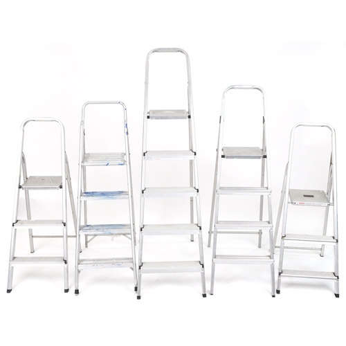 1165A - Five aluminium folding stepladders, the largest 168cm high when closed