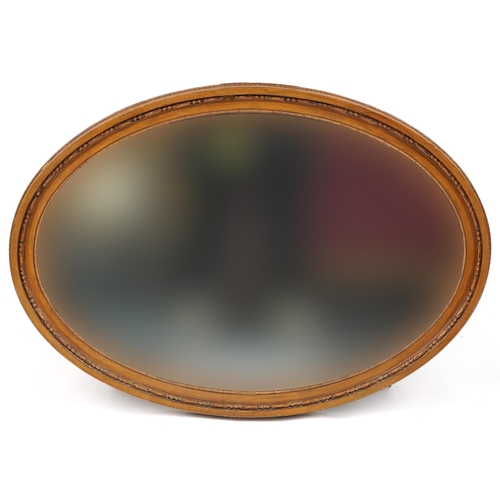 1240 - Two oval gilt framed wall mirrors with bevelled glass, the largest 93cm x 58cm