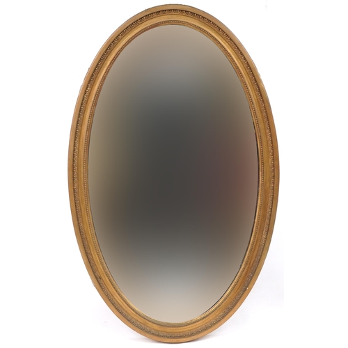 1240 - Two oval gilt framed wall mirrors with bevelled glass, the largest 93cm x 58cm