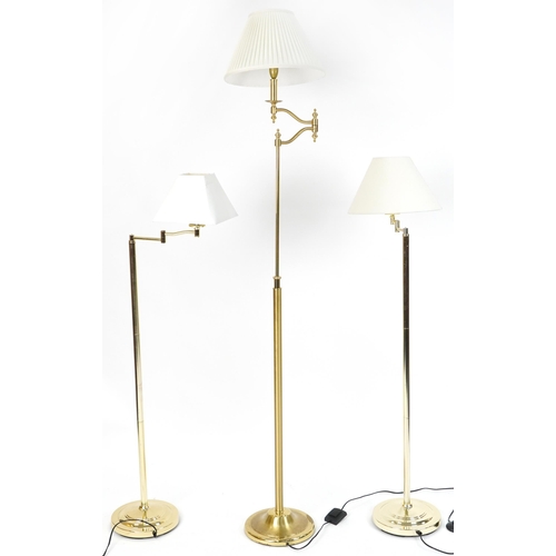 1190 - Three contemporary adjustable brass standard lamps with cream shades including a pleated example