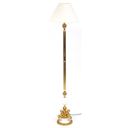 1023 - Venetian style gilt brass and white marble standard lamp surmounted with three Putti having a cream ... 