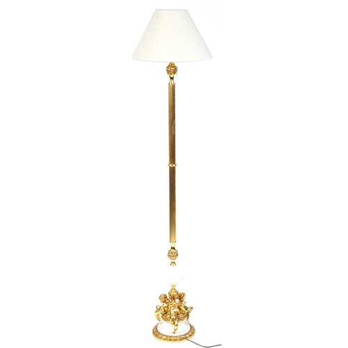 1023 - Venetian style gilt brass and white marble standard lamp surmounted with three Putti having a cream ... 