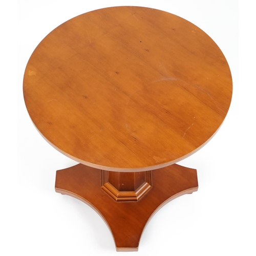 1176A - William L Maclean, Art Deco style hardwood centre table with circular top and octagonal tapering col... 