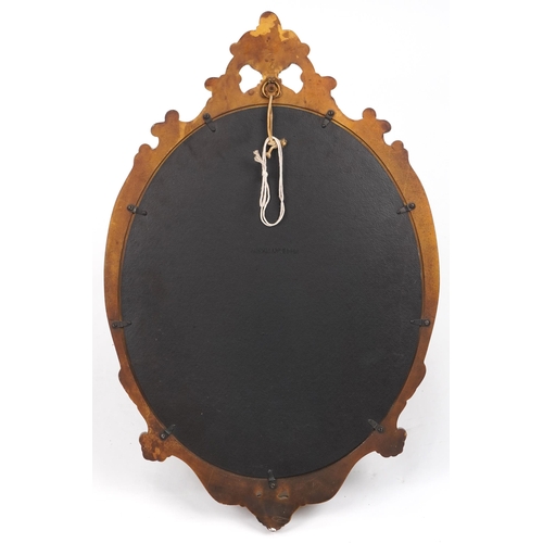 1239 - Ornate gilt framed oval wall mirror decorated with acanthus leaves, 72cm x 47cm