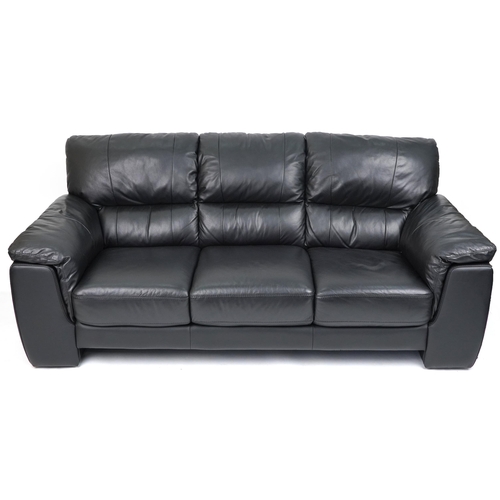 1131 - Contemporary three seater settee with black leather upholstery and footstool, the settee 90cm H x 20... 