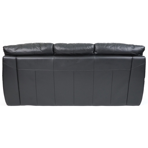 1131 - Contemporary three seater settee with black leather upholstery and footstool, the settee 90cm H x 20... 